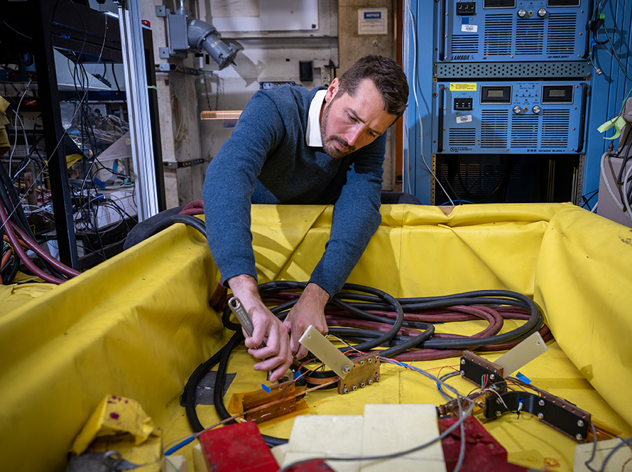 Researcher sets up a high-temperature-superconductor experiment