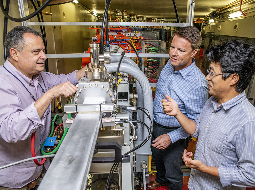 Researchers discuss an electron injector beamline