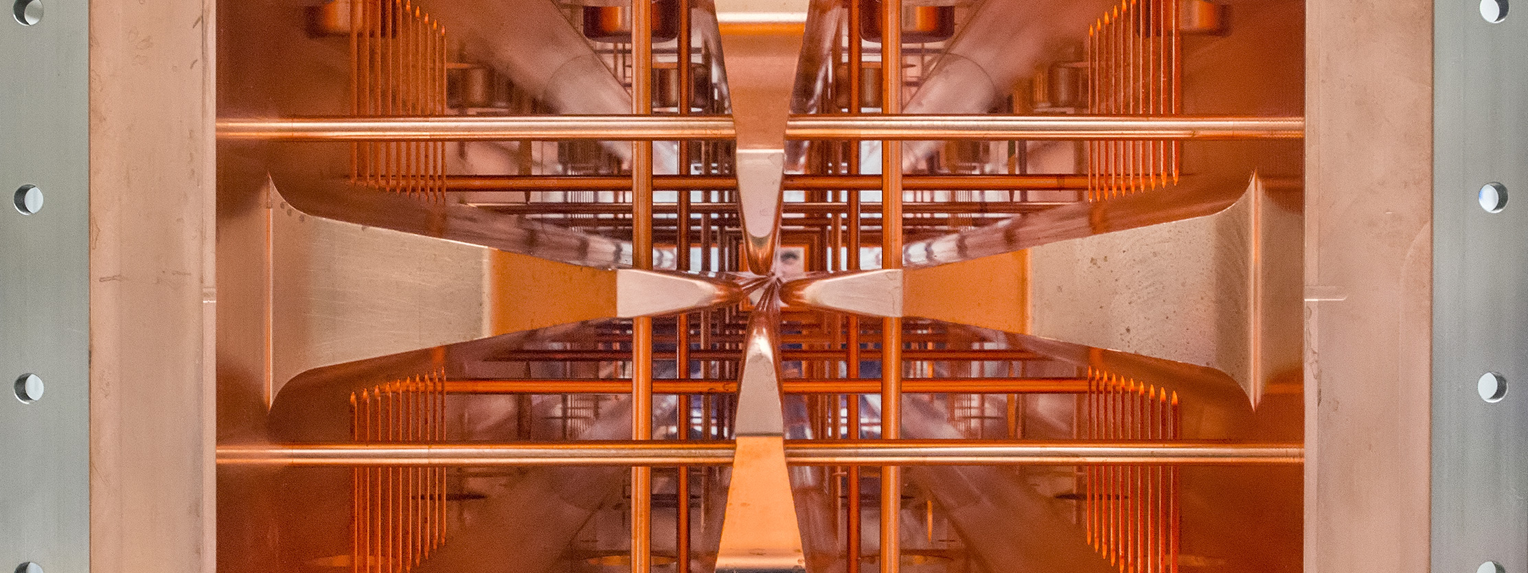 Interior of copper colored RFQ linac structure